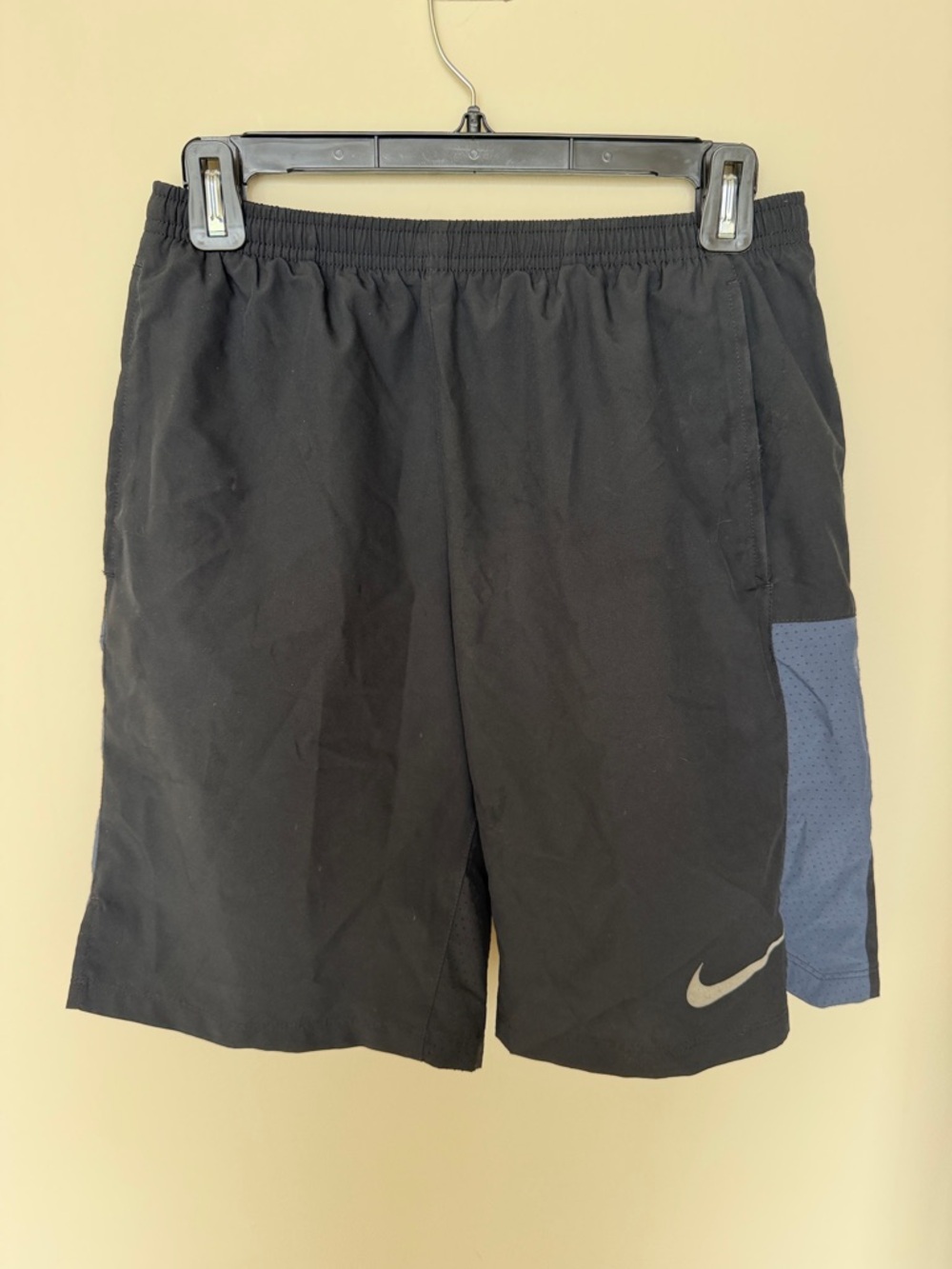 Nike Men’s Black Athletic Shorts with Blue Side Panel and Reflective Swoosh
